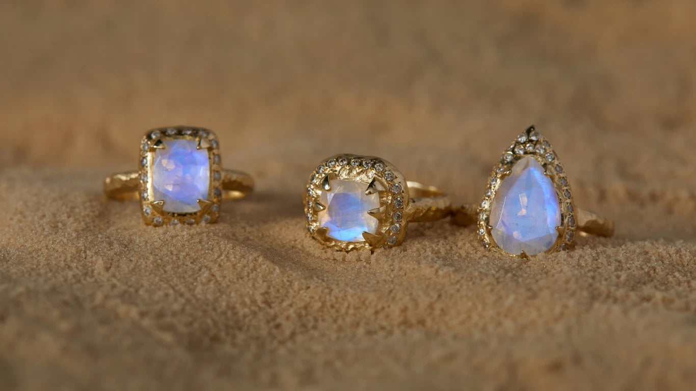 14K gold jewelry, rings, earrings and necklaces set with a blue Moonstone and diamonds.