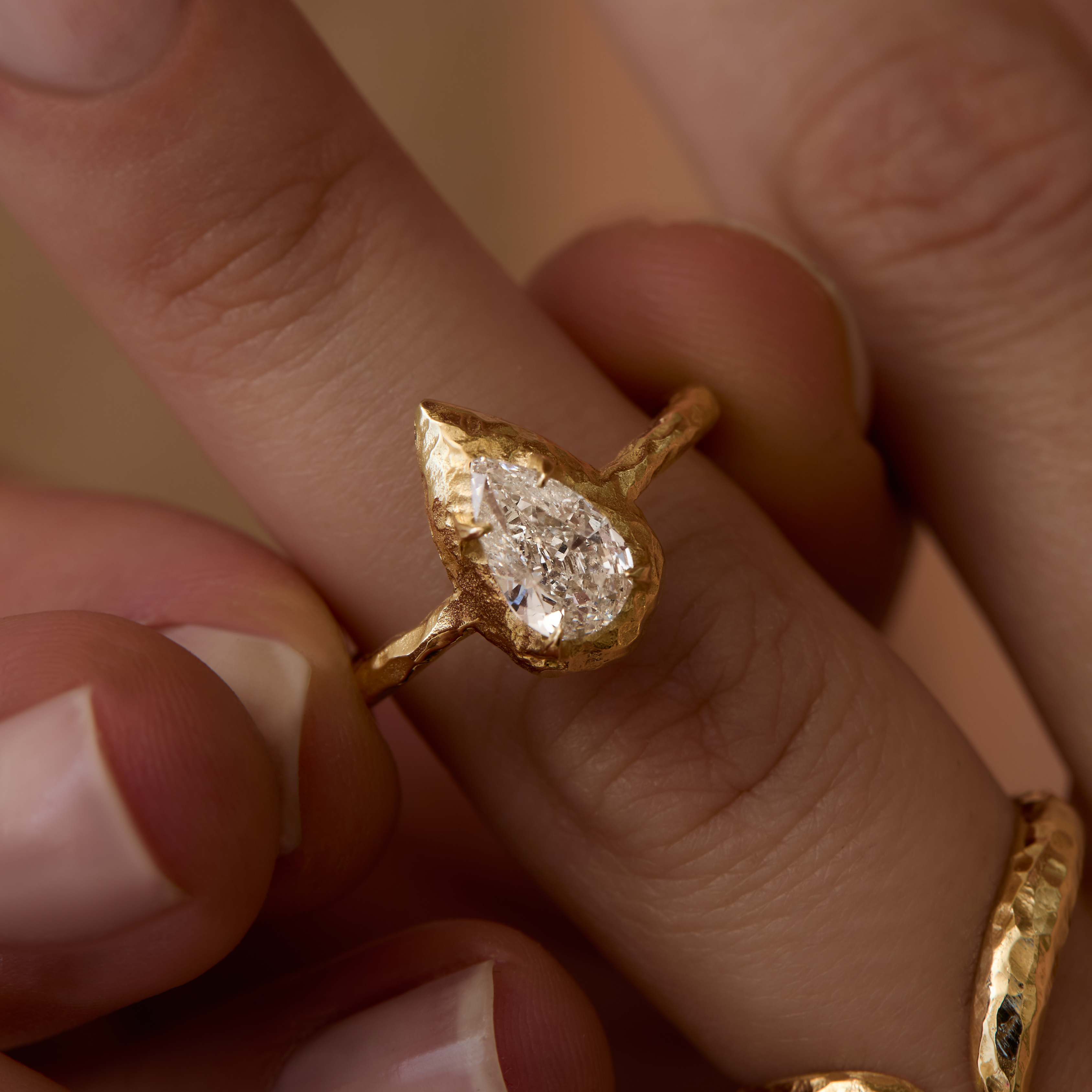 North-South Pear-cut Engagement Ring