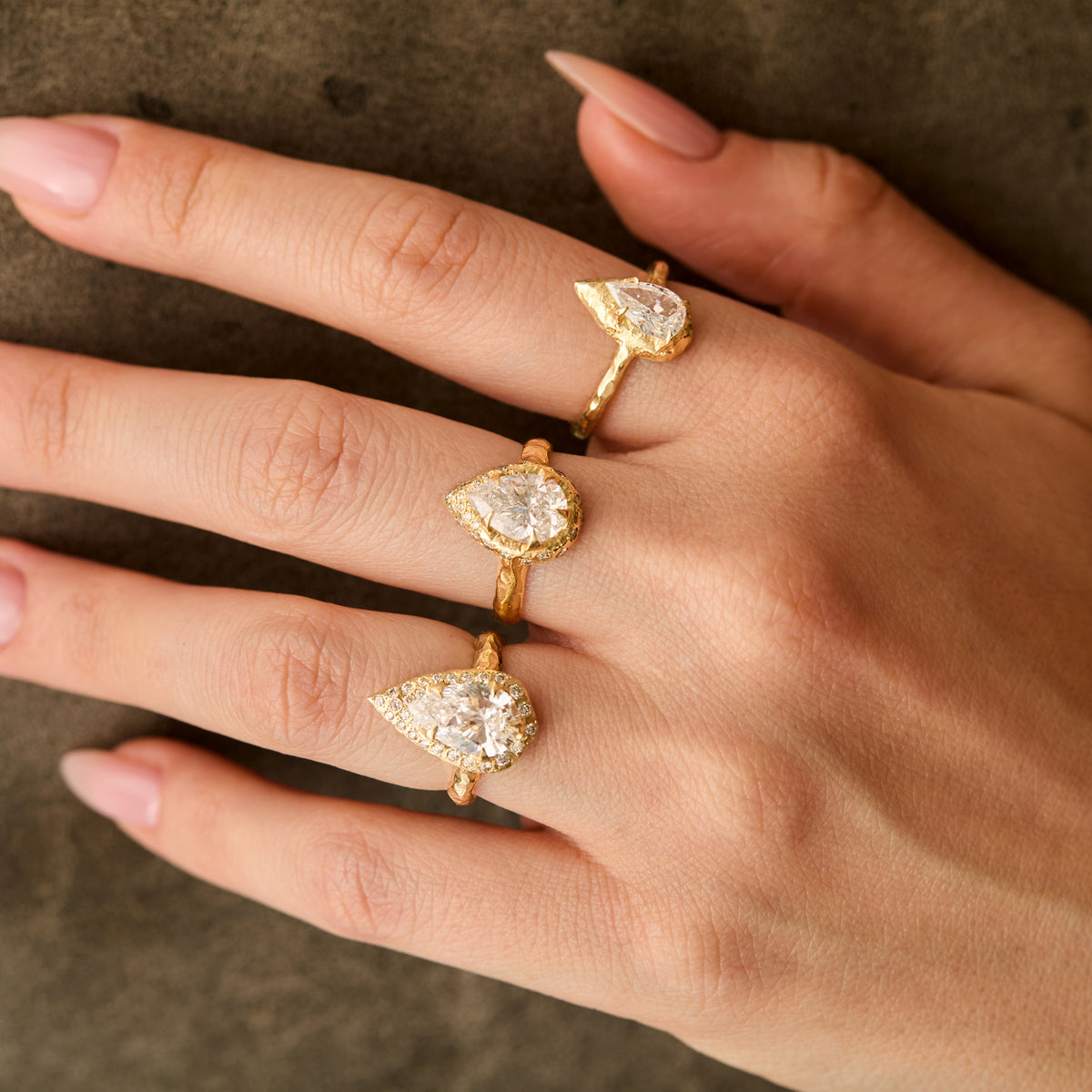 three diamond engagement rings on hand. lizzy's diamond ring 2 ct natural diamond