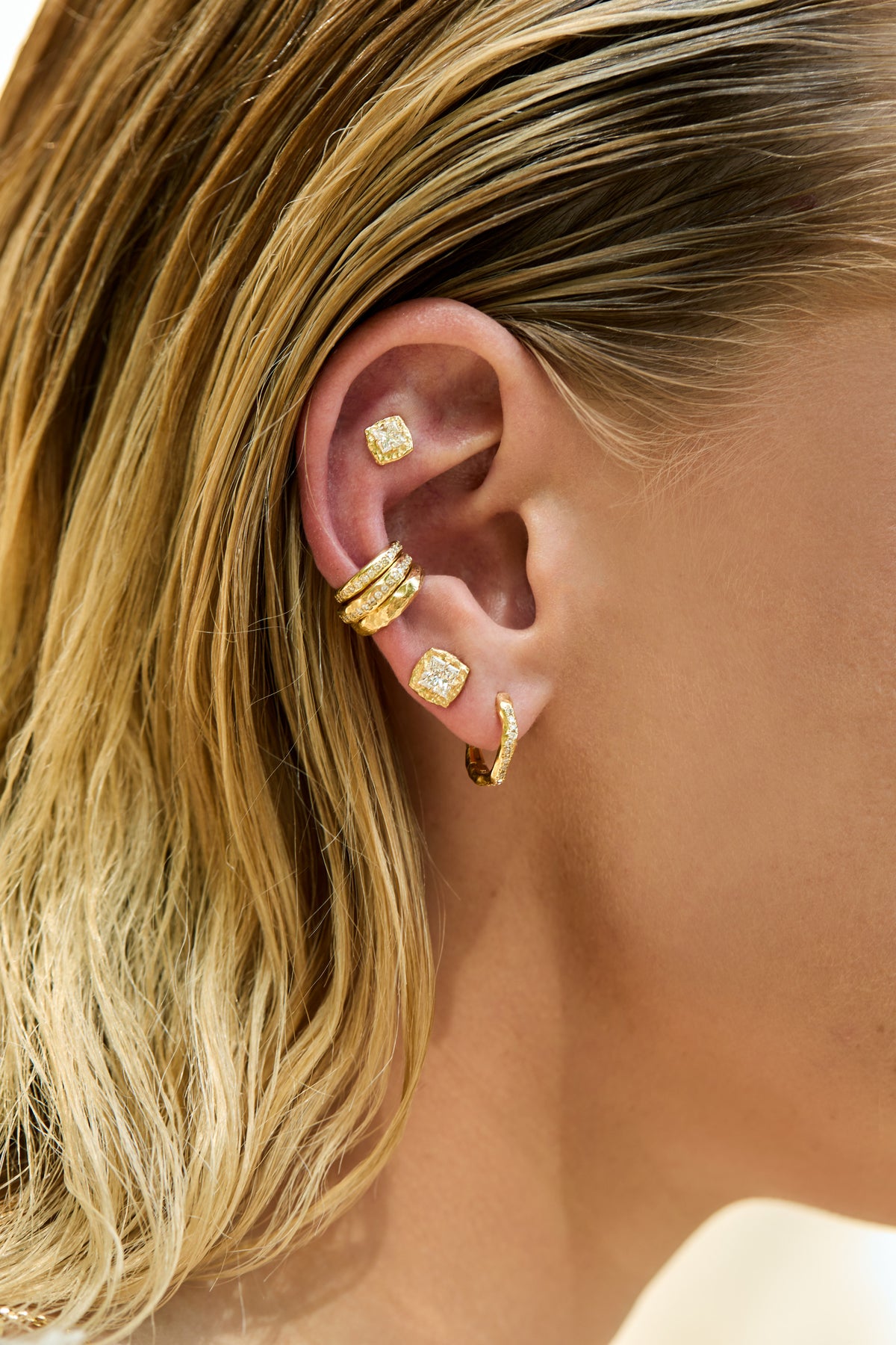 Princess diamond stud earrings small and big with hand-carved organic texture and earcuffs on model
