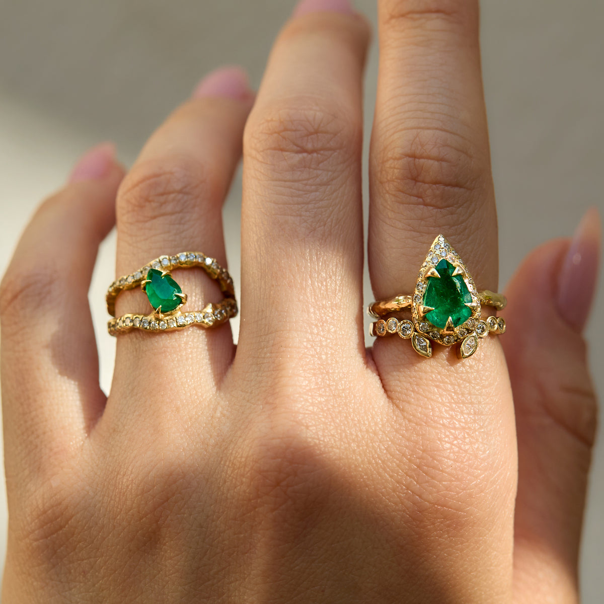 mystic ring with 2.35 ct pear-shaped natural emerald, natural diamond detailing and hand-carved textured 14K yellow gold band with diamond ring and emerald diamond ring