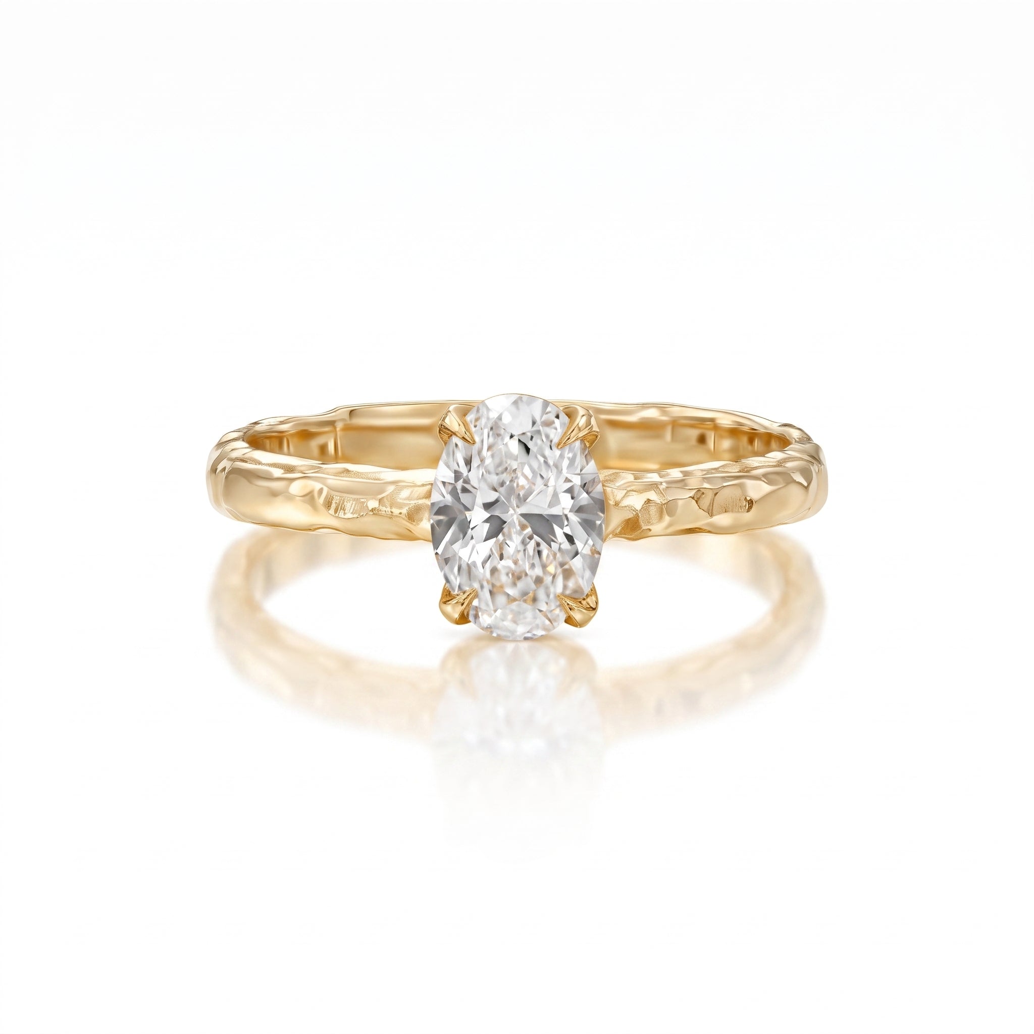 danielle gerber 1 ct natural oval diamond engagement ring with hand-carved textured 14K yellow gold band.