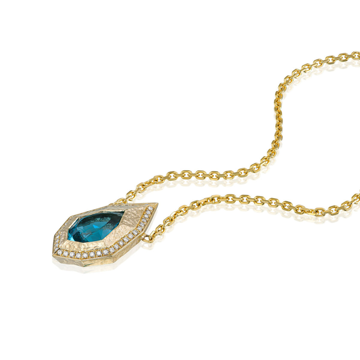 Angled view of blue-green lagoon tourmaline and natural diamond necklace with geometric 14K yellow gold pendant.