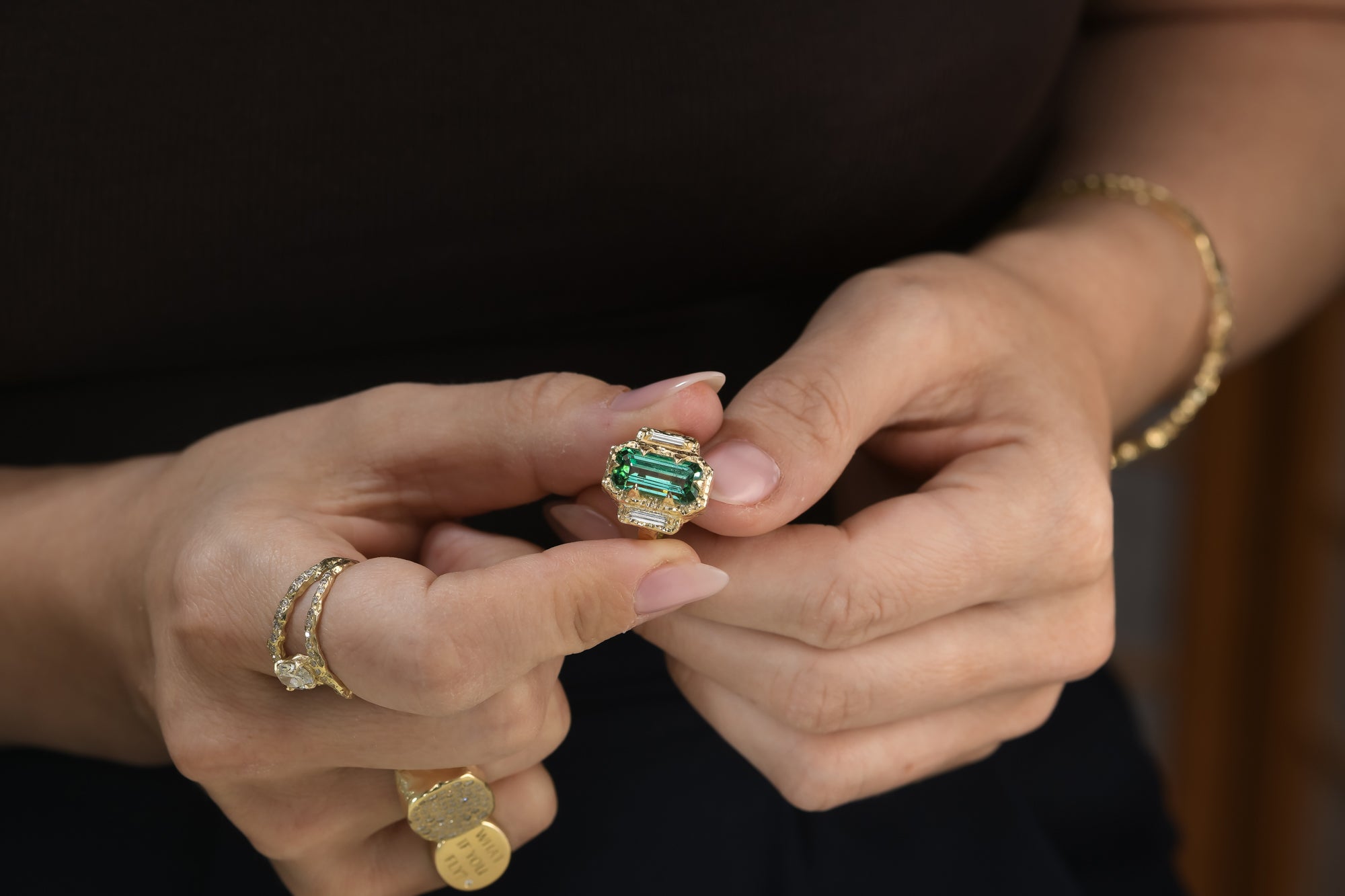 Emerald-cut lagoon tourmaline and baguette diamond ring in a hand-carved sculptural 14K yellow gold setting.