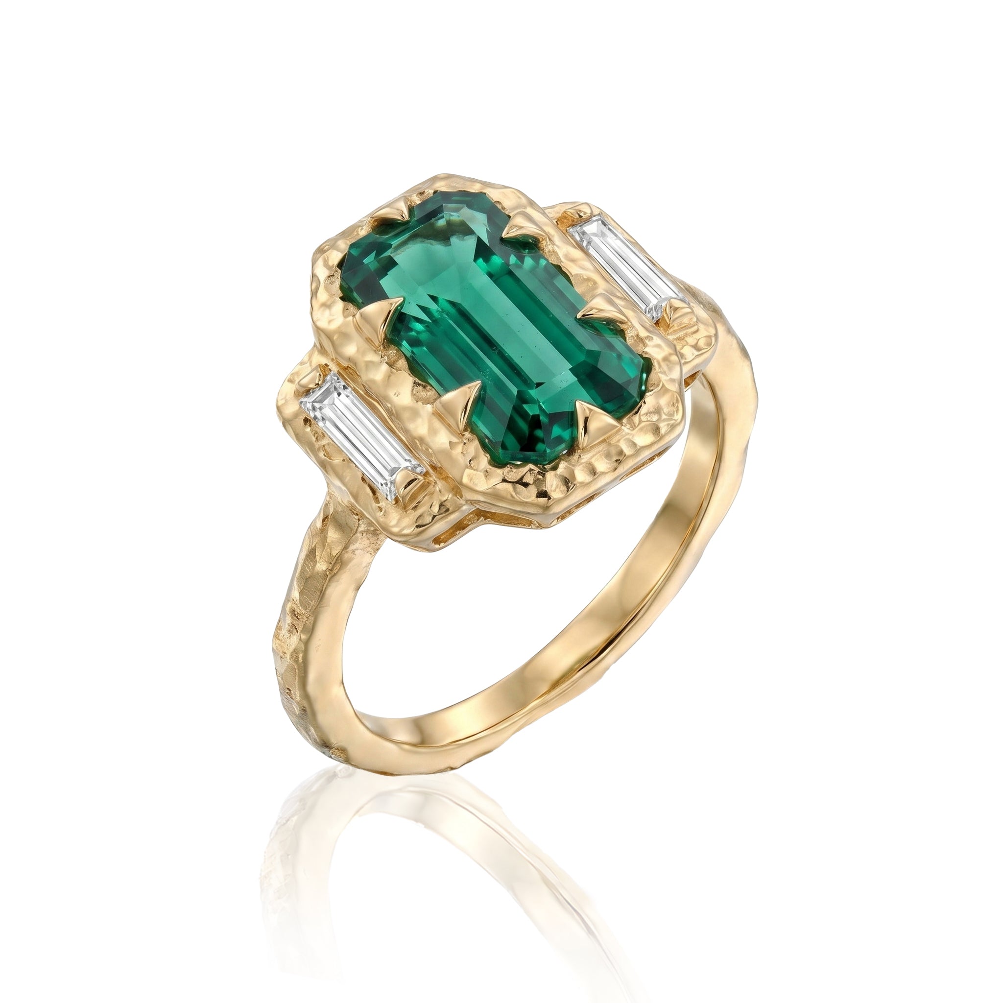 Angled view of 5.6 ct blue-green lagoon tourmaline ring with natural baguette diamonds and textured 14K yellow gold.