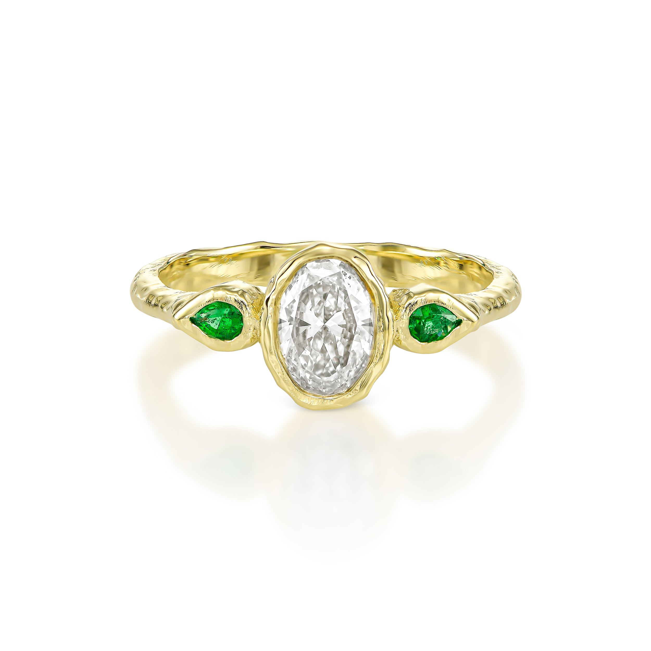 Oval diamond and pear emeralds engagement ring in 14K yellow gold with hand-carved organic texture