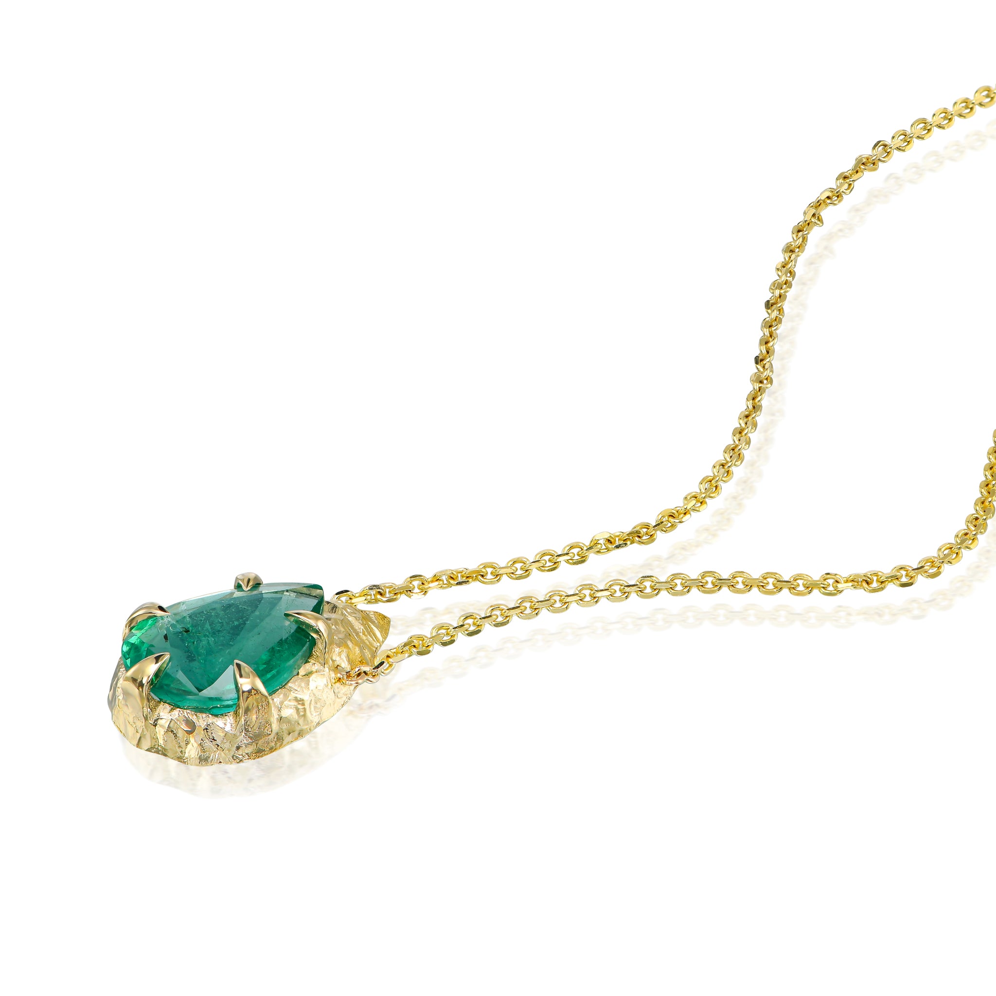 Pear-cut natural emerald drop necklace with hand-carved textured 14K yellow gold setting and delicate gold chain.