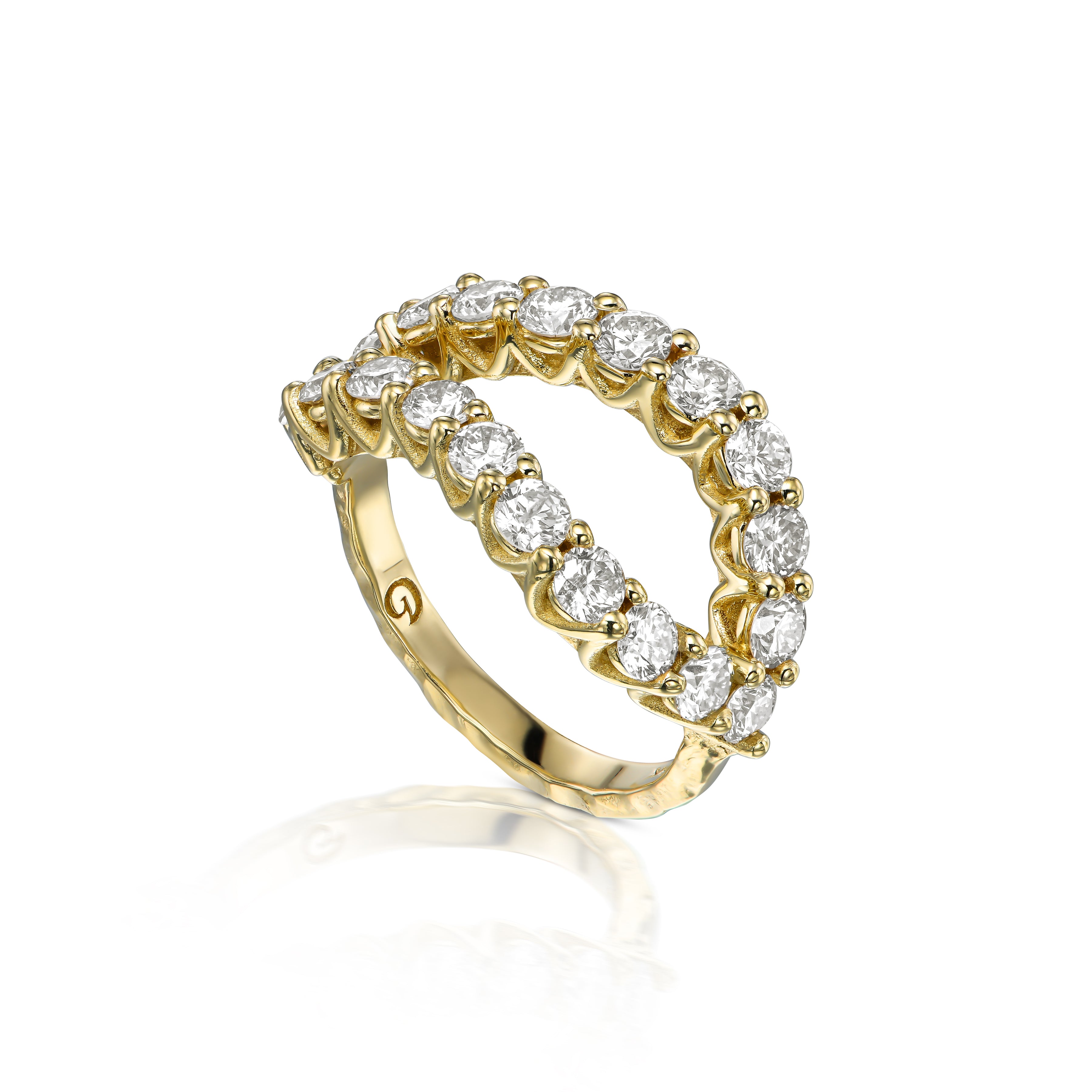 Angled view of bold natural diamond infinity ring with 2 ct of diamonds and sculptural textured 14K yellow gold.