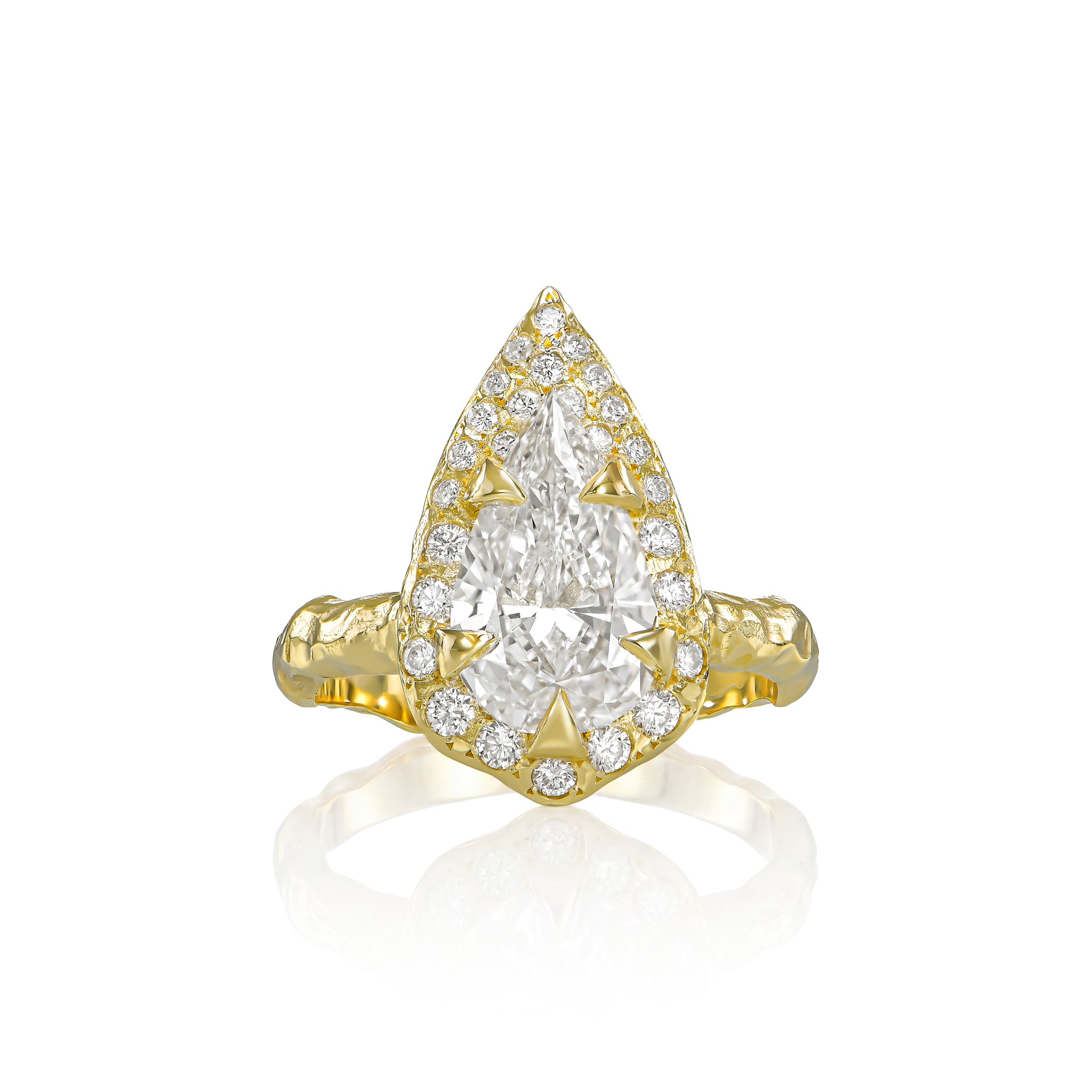 2 CT pear-shaped natural diamond engagement ring with diamond halo and hand-carved organic gold band.