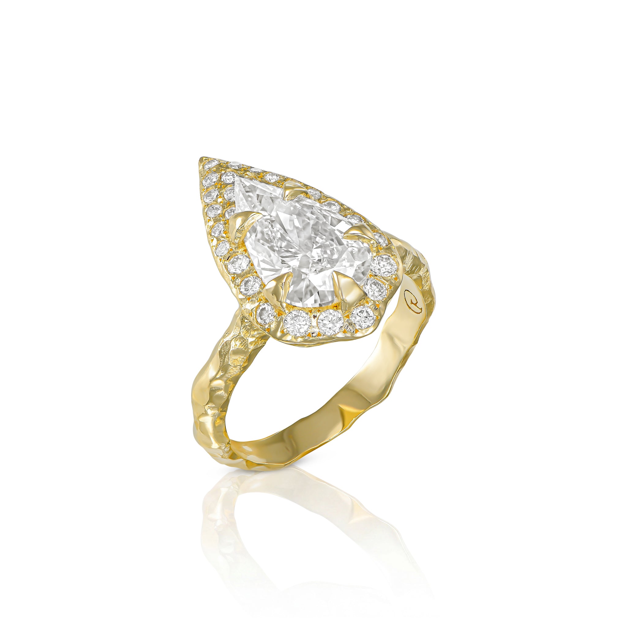 Front view of a 2 CT pear diamond halo engagement ring with a sculptural textured gold band.
