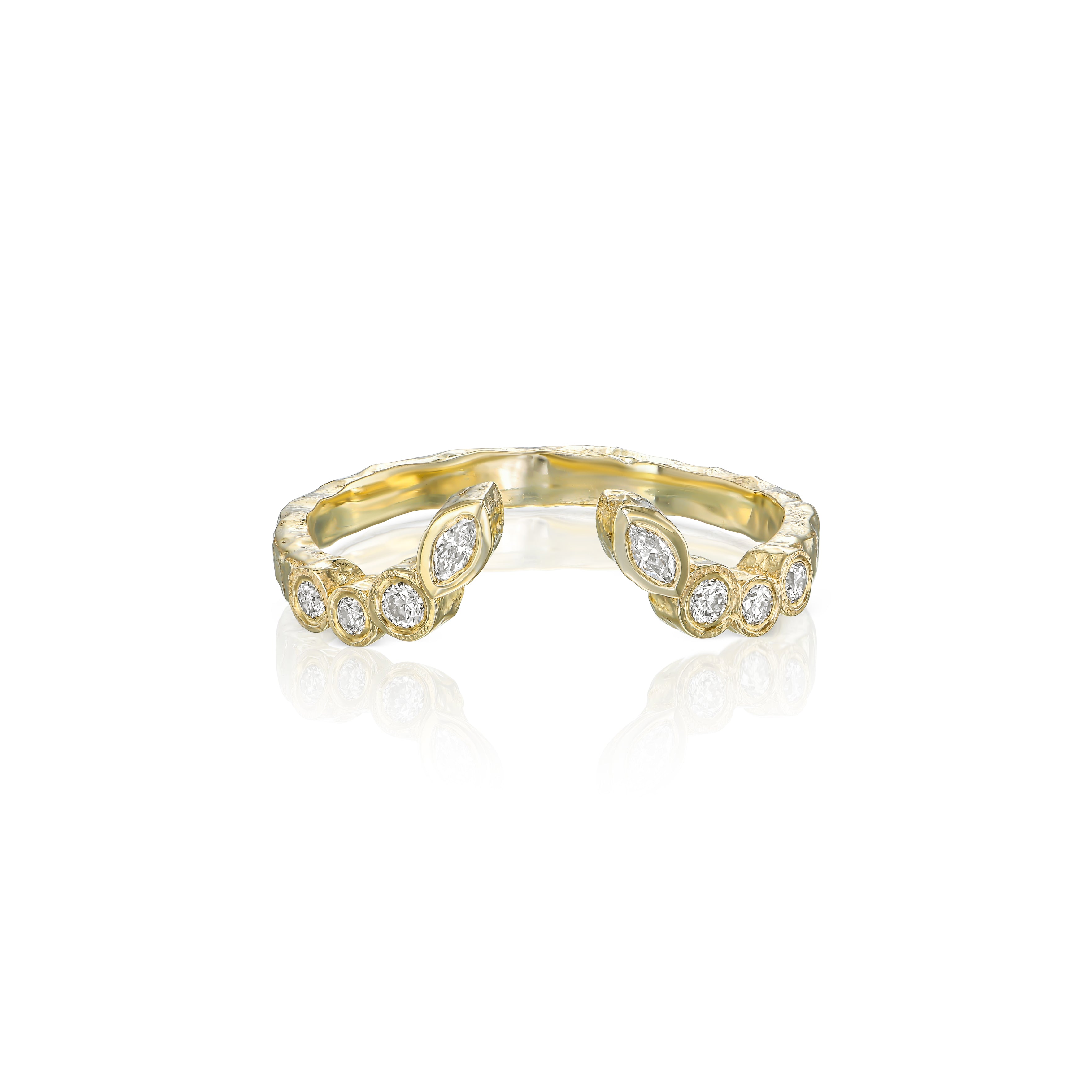 Front view of an open textured gold ring featuring marquise and round bezel-set natural diamonds.