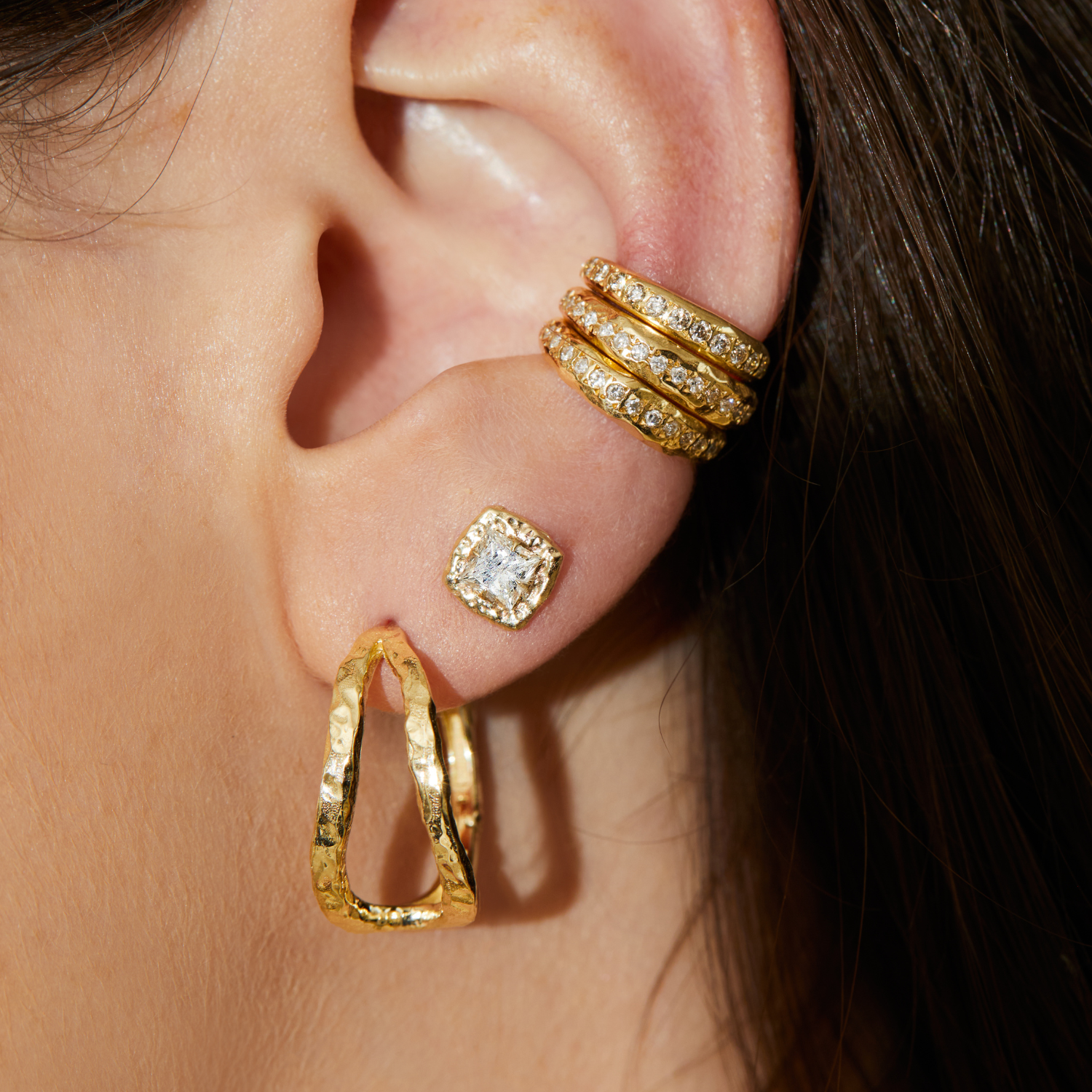 Diamond stud earrings with princess-cut diamonds and organic textured gold